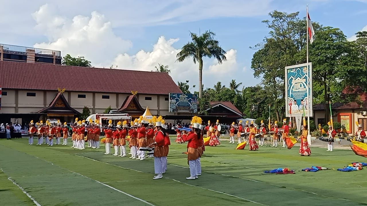 KIPRAH DRUMBAND DHAMMA GITA BAHANA SMPS PELOPOR MANDAU PADA PERINGATAN HARI GURU NASIONAL TH.2022 DAN JAMBORE PGRI SE PROVINSI RIAU